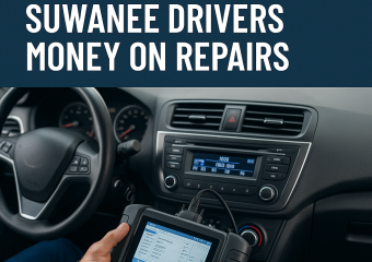 Car mechanic using a diagnostic tool inside a vehicle to help save Suwanee drivers money on repairs.